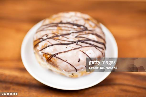 a doughnut/ donuts - raze stock pictures, royalty-free photos & images