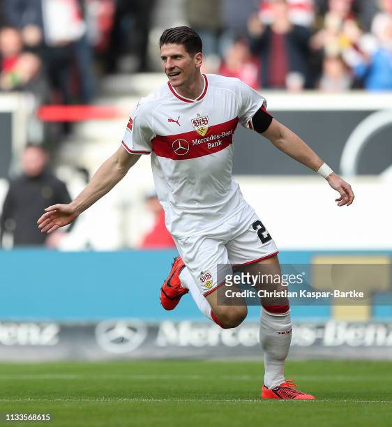 Mario Gomez of VfB Stuttgart celebrates after scoring his team`s first goal during the Bundesliga match between VfB Stuttgart and Hannover 96 at...