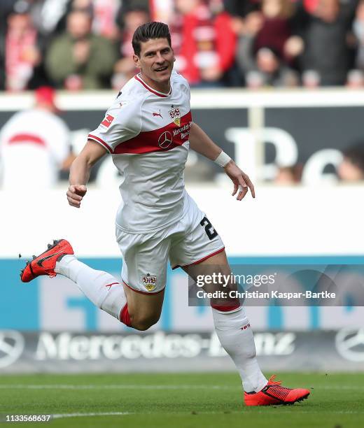 Mario Gomez of VfB Stuttgart celebrates after scoring his team`s first goal during the Bundesliga match between VfB Stuttgart and Hannover 96 at...