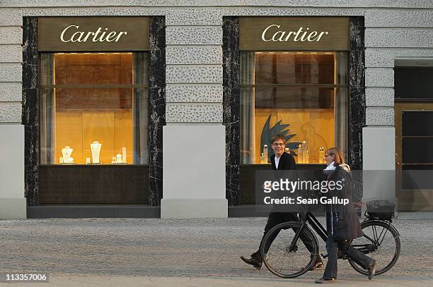 People walk by a Cartier luxury goods store on Kurfuerstendamm avenue on April 27, 2011 in Berlin, Germany. Kurfuerstendamm, known locally as Ku'damm...