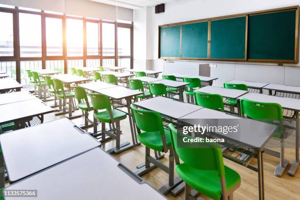 empty classroom with desks and chairs - desk with green space view stock pictures, royalty-free photos & images