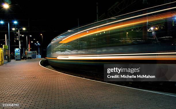 train motion blur.. - victoria station manchester stock pictures, royalty-free photos & images