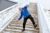 Senior man on a icy staircase falling