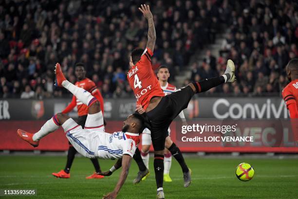 Rennes' Mozambican defender Edson Mexer vies with Lyon's French forward Moussa Dembele during the French L1 football match Stade Rennais vs Olympique...