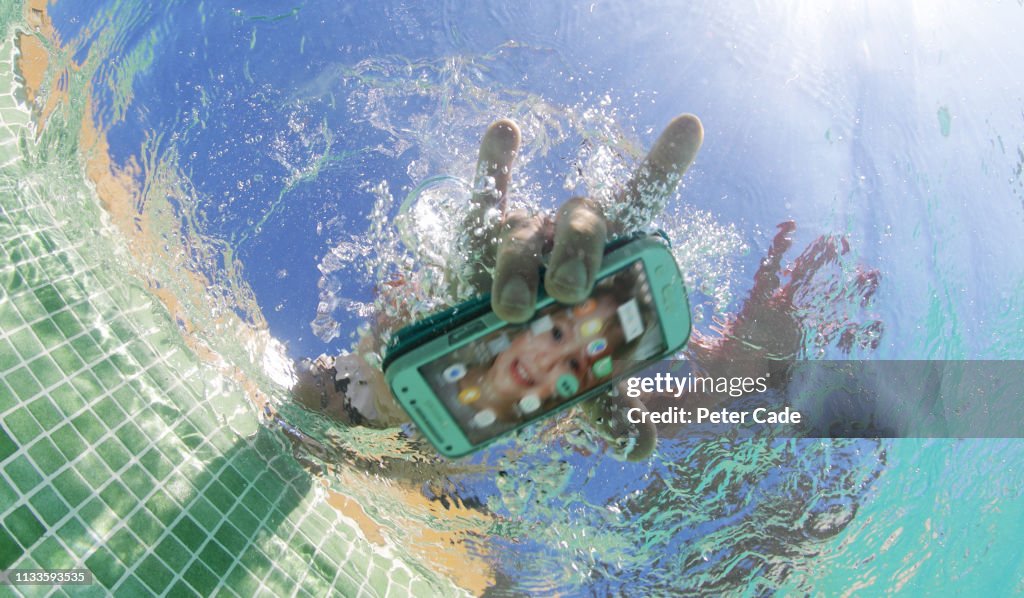 Dropping mobile phone in pool