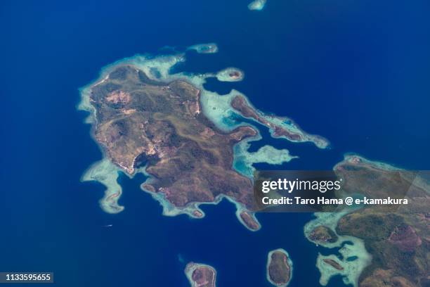 sulu sea and coral-colored islands in philippines daytime aerial view from airplane - sulusjön bildbanksfoton och bilder
