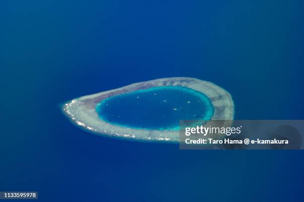 investigator northeast shoal in spratly islands in the south china sea in philippines daytime aerial view from airplane - south china sea stock pictures, royalty-free photos & images