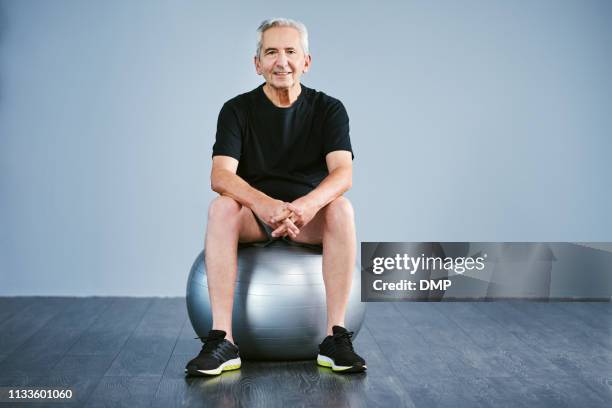 the greatest investment i made was in my health - fitness ball imagens e fotografias de stock