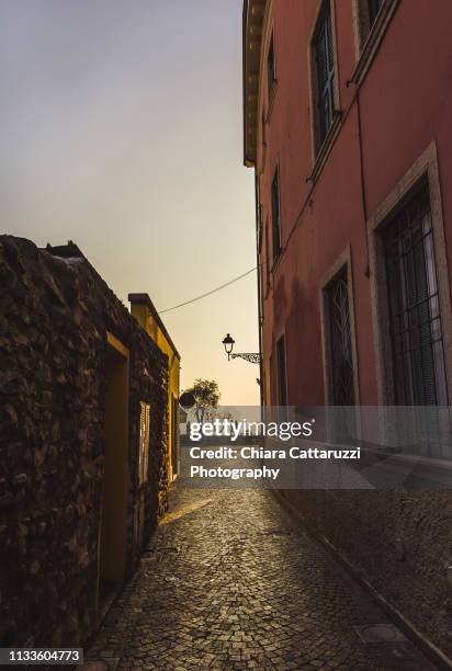 a little italian alley of an ancient village in a warm sunlight - strada deserta bildbanksfoton och bilder
