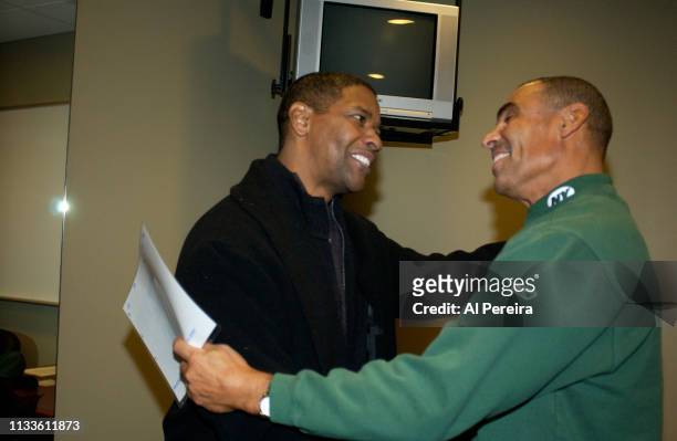 Actor Denzel Washington meets with New York Jets Head Coach Herm Edwards in the locker room when he attends the New York Jets v Seattle Seahawks game...
