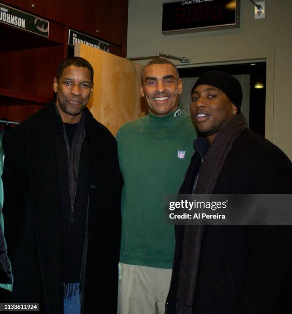 Actor Denzel Washington and his son, John David Washington, meet with New York Jets Head Coach Herm Edwards in the locker room when he attends the...
