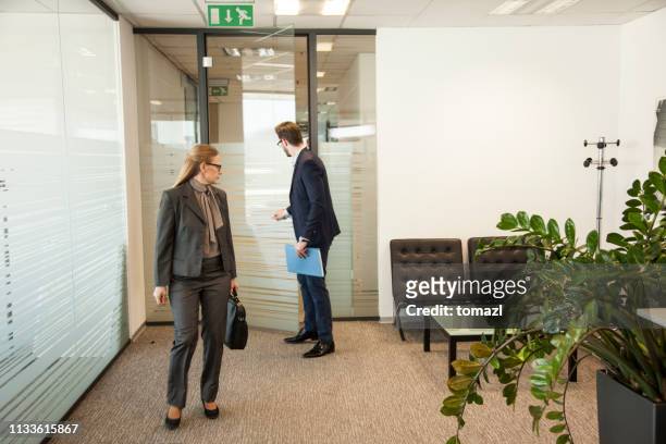 business people comming to a meeting - closing door stock pictures, royalty-free photos & images