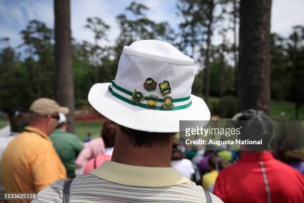 Masters patron displays souvenir pins during the third round of the Masters at Augusta National on Saturday, April 11, 2015.