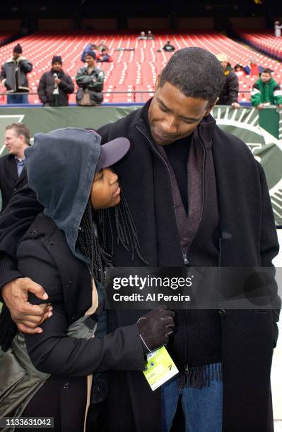 Actor Denzel Washington and his daughter, Katia, follow the action on the New York Jets sideline when he attends the New York Jets v Seattle Seahawks...