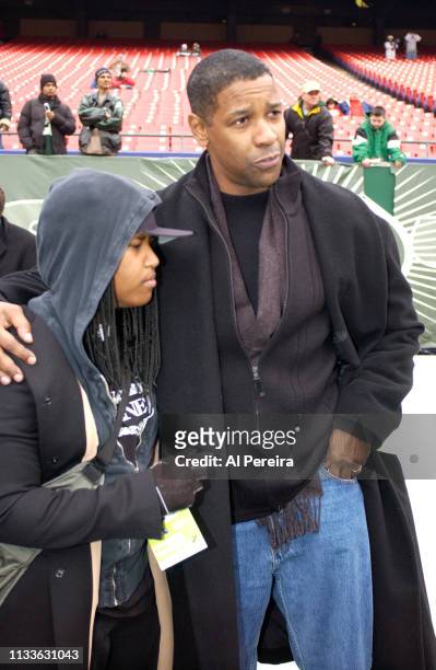Actor Denzel Washington and his daughter, Katia, follow the action on the New York Jets sideline when he attends the New York Jets v Seattle Seahawks...