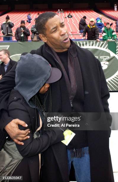 Actor Denzel Washington and his daughter, Katia, follow the action on the New York Jets sideline when he attends the New York Jets v Seattle Seahawks...