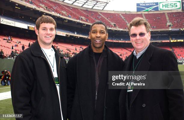 Actor Denzel Washington meets with New York Jets General Manager Terry Bradway and his son, Mike, on the New York Jets sideline when he attends the...