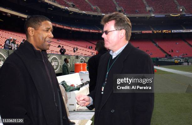 Actor Denzel Washington meets with New York Jets General Manager Terry Bradway on the New York Jets sideline when he attends the New York Jets v...