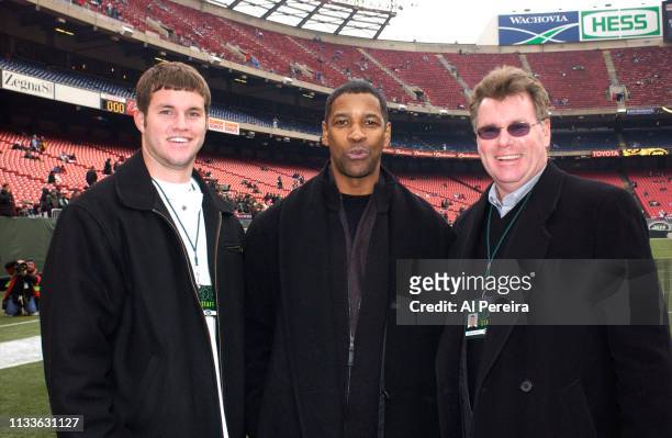 Actor Denzel Washington meets with New York Jets General Manager Terry Bradway and his son, Mike, on the New York Jets sideline when he attends the...