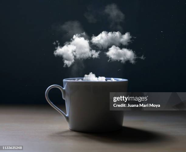 conceptual photo of a cup with clouds - coffee steam stock pictures, royalty-free photos & images