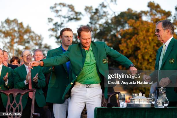 Master Champion Danny Willett of England and Masters champion Jordan Spieth during the Green Jacket Presentation at Augusta National Golf Club on...