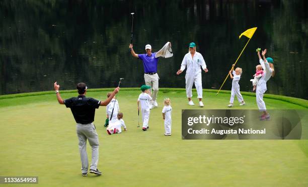 Masters champion Bubba Watson along with his wife Angie Watson and their two children son Caleb and daughter Dakota and Webb Simpson with his wife...