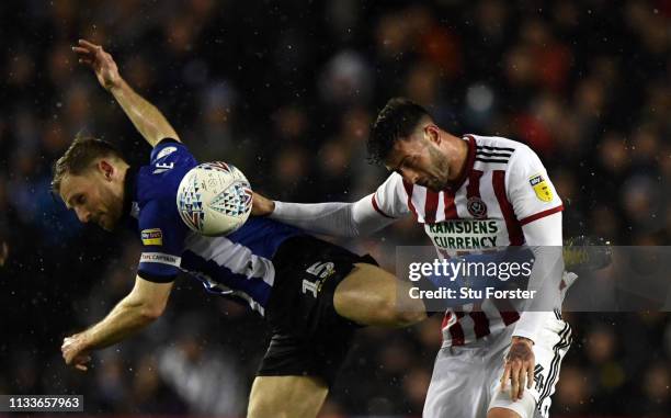 Tom Lees of Sheffield Wednesday and Gary Madine of Sheffield United compete for the ball during the Sky Bet Championship match between Sheffield...