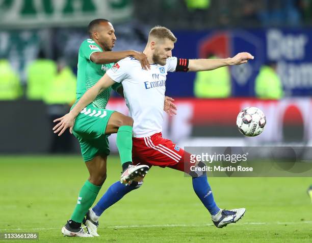 Aaron Hunt of Hamburg is challenged by Julian Green of Fuerth during the Second Bundesliga match between Hamburger SV and SpVgg Greuther Fuerth at...