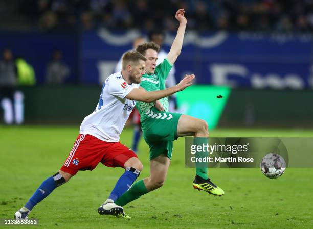 Aaron Hunt of Hamburg is challenged by Paul Jäckel of Fuerth during the Second Bundesliga match between Hamburger SV and SpVgg Greuther Fuerth at...