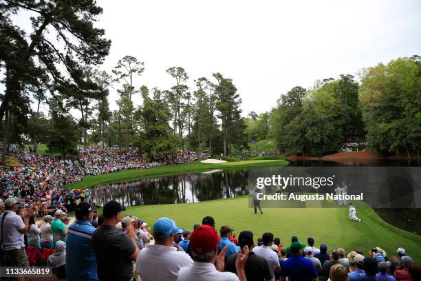 Masters champion Gary Player of South Africa putts as Masters champion Tom Watson and Masters champion Jack Nicklaus watch during the Par 3 Contest...