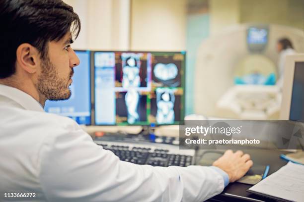 doctor is working with ct scan in hospital - radiation stock pictures, royalty-free photos & images