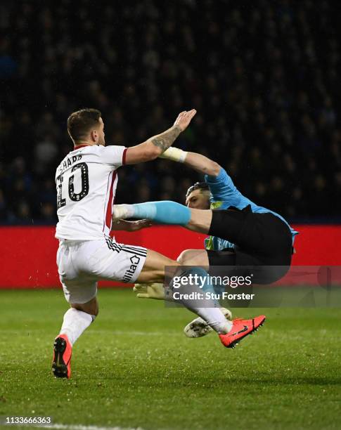 Billy Sharp of Sheffield United collides with goalkeeper Keiren Westwood of Sheffield Wednesday during the Sky Bet Championship match between...