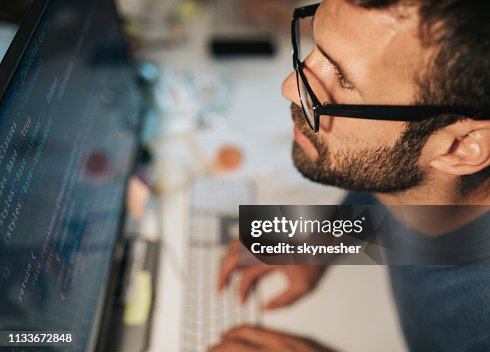 Concentrated Programmer Reading Computer Codes On Desktop Pc High-Res ...