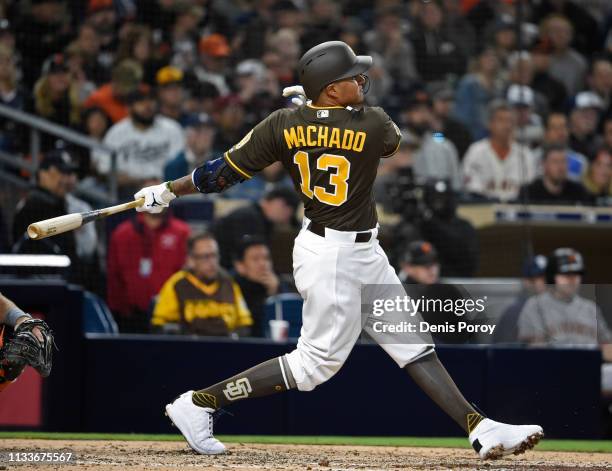 Manny Machado of the San Diego Padres hits a single during the fifth inning against the San Francisco Giants at Petco Park March 29, 2019 in San...