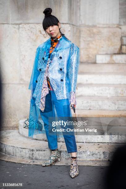 Susie Lau is seen wearing blue see through coat outside Stella McCartney during Paris Fashion Week Womenswear Fall/Winter 2019/2020 on March 04, 2019...