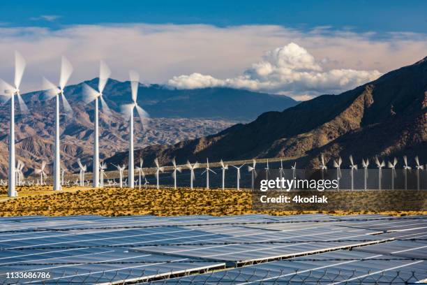 wind turbines and solar panels - california power lines stock pictures, royalty-free photos & images