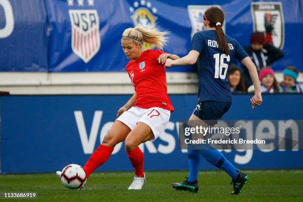 Rose Lavelle of the USA plays against Rachel Daley of England during the second half of the 2019 SheBelieves Cup match between USA and England at...