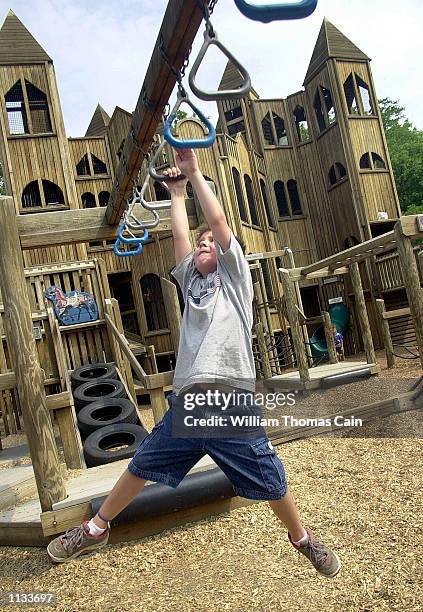 Grayson Goga plays at Kid's Castle at Central Park Playground, which is made from pressure-treated wood, July 18 in Doylestown, Pa. Earlier this...
