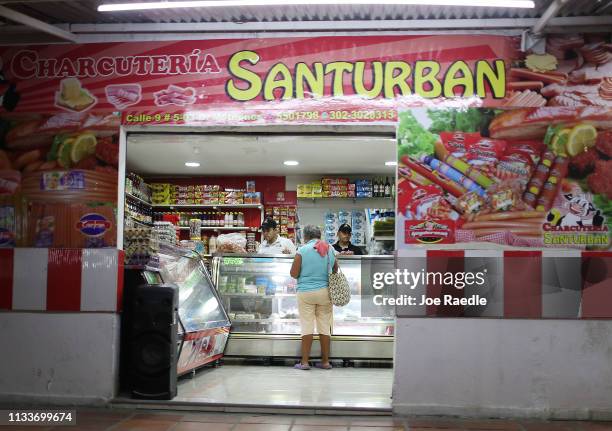 Woman shops as the town sees an influx of Venezuelans that are crossing the border on March 4, 2019 in Cucuta, Colombia. Many Venezuelans have left...