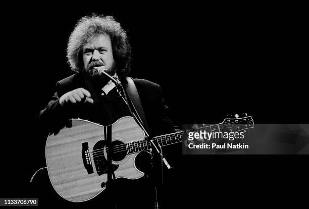 American Country musician Don Schlitz plays guitar as he performs onstage at the Grand Ole Opry, Nashville, Tennessee, December 1, 1993.