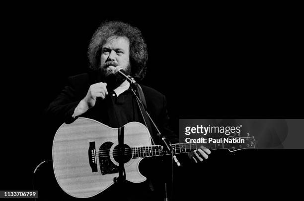 American Country musician Don Schlitz plays guitar as he performs onstage at the Grand Ole Opry, Nashville, Tennessee, December 1, 1993.