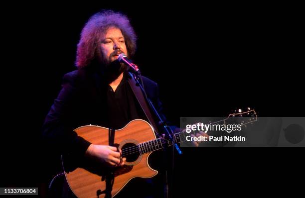 American Country musician Don Schlitz plays guitar as he performs onstage at the Grand Ole Opry, Nashville, Tennessee, December 1, 1993.