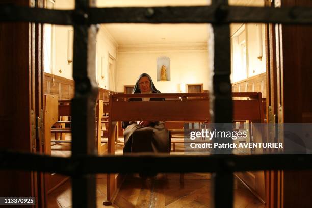 The Last Carmelite Sisters In Pamiers, France On July 29, 2008 - Saint Therese of the Child Jesus , prioress of the Caramel pray behind the gates of...