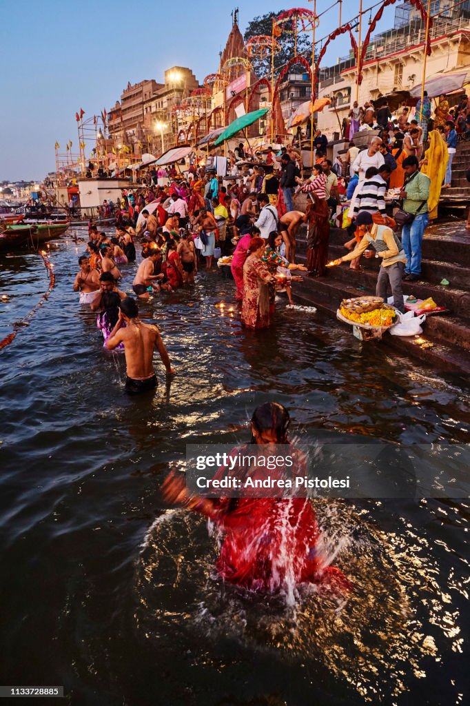 Hindu pilgrims bathing in the sacred Ganges river, Varanasi