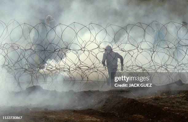 This picture taken on March 30, 2019 from the southern Israeli kibbutz of Nahal Oz across the border from the Gaza Strip, shows a Palestinian...