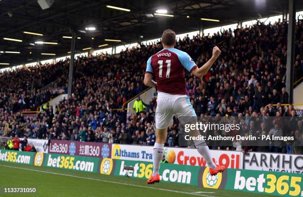 Burnley's Chris Wood celebrates after Wolverhampton Wanderers' Conor Coady puts the ball in to the back of his own net for an own goal and the first...