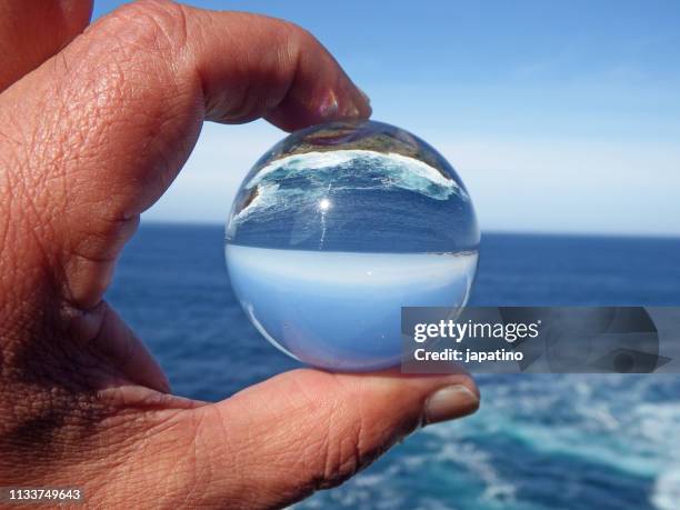 seascape through a crystal ball - olas rompientes stock pictures, royalty-free photos & images
