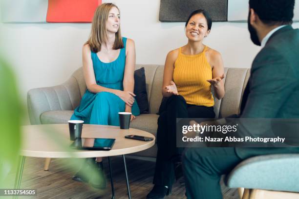 mixed race woman taking lead. - new zealand yellow stock pictures, royalty-free photos & images