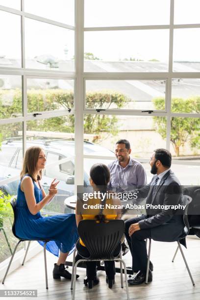small business meeting. - new zealand yellow stock pictures, royalty-free photos & images