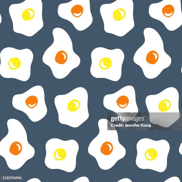 seamless fried egg pattern illustration, dark blue background - scrambled eggs stock illustrations